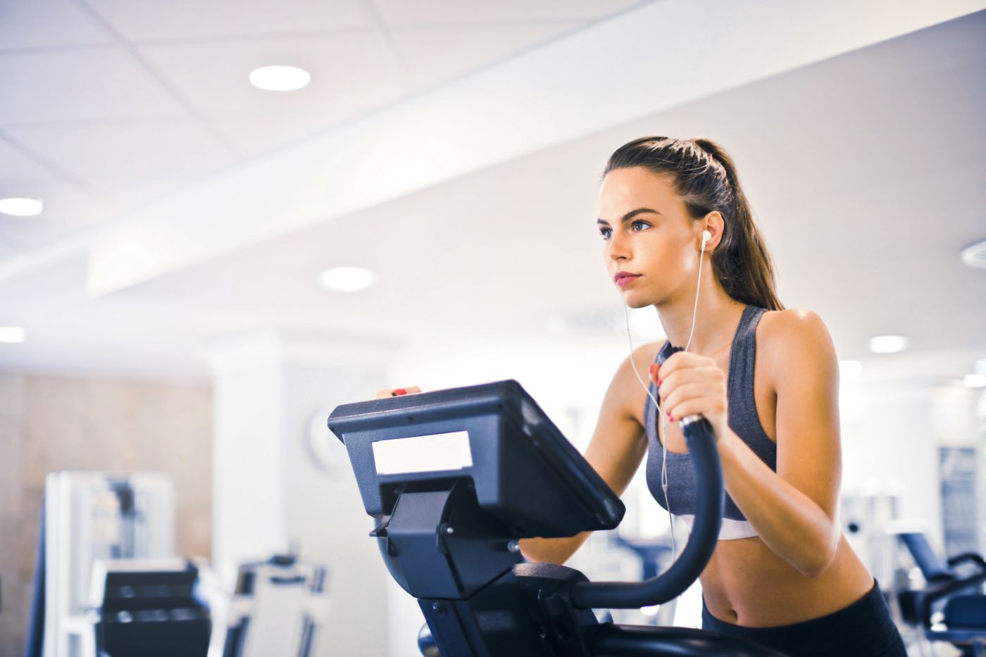 Woman stretching in a bright fitness studio